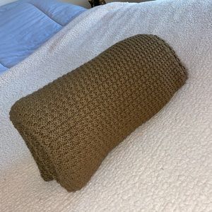 Knit cozy throw on blanket